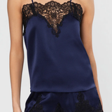 Navy blue satin top with lace details on a white background