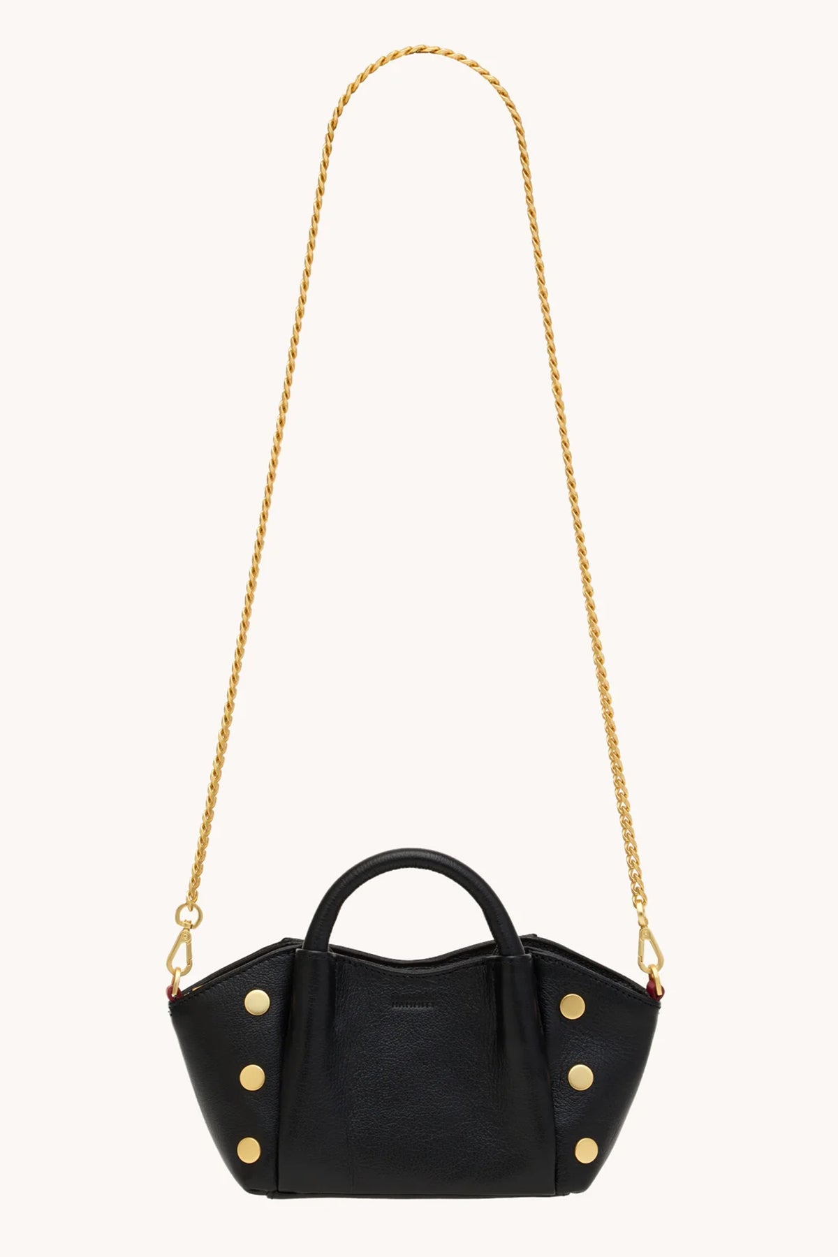 Black Hammitt Paul Mini crossbody bag worn with an evening outfit.
