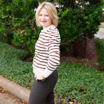 Striped knit sweater top styled for everyday wear.