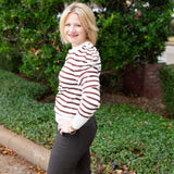 Striped knit sweater top styled for everyday wear.