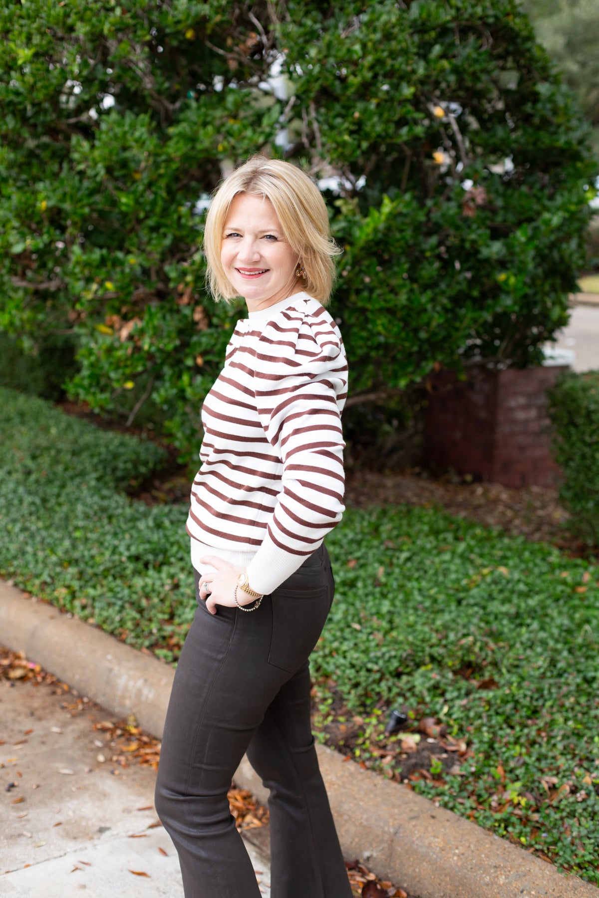 Striped knit sweater top styled for everyday wear.