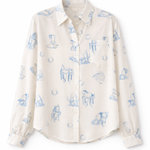 White blouse with blue floral pattern on a white background