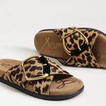 Leopard print sandals with gold buckles on a white background