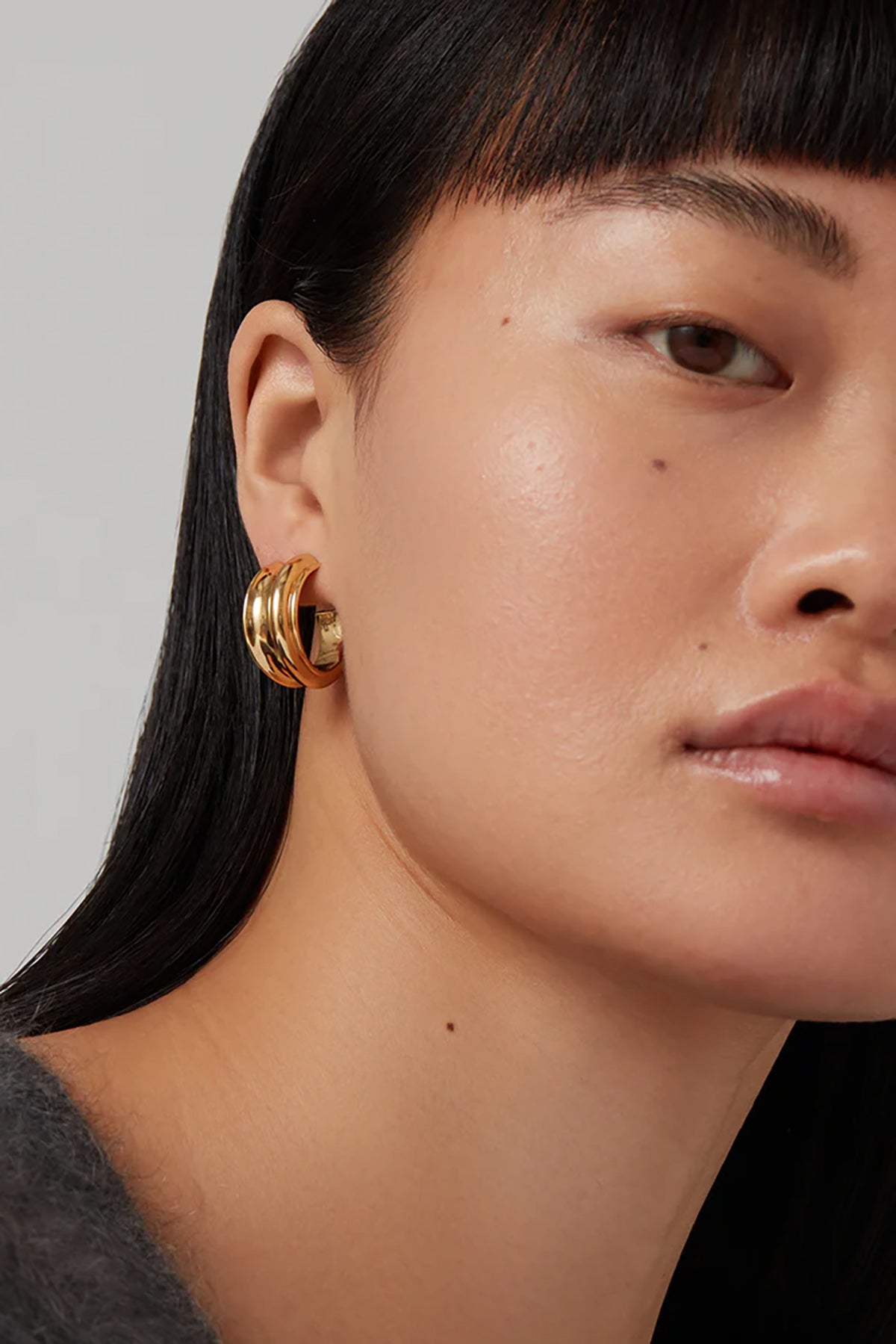 Gold hoop earrings with a smooth, polished finish.