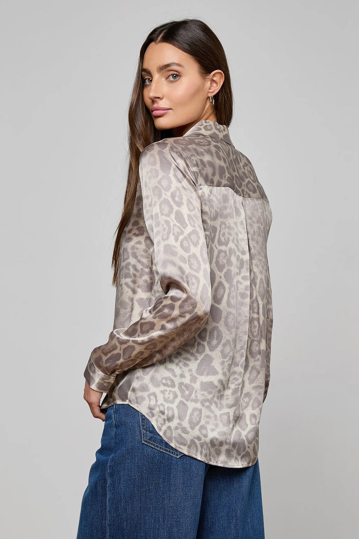 Long-sleeve blouse with a smooth, polished finish.