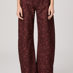 Women's printed full-length pants featuring an etched tulip pattern in rich garnet tones.