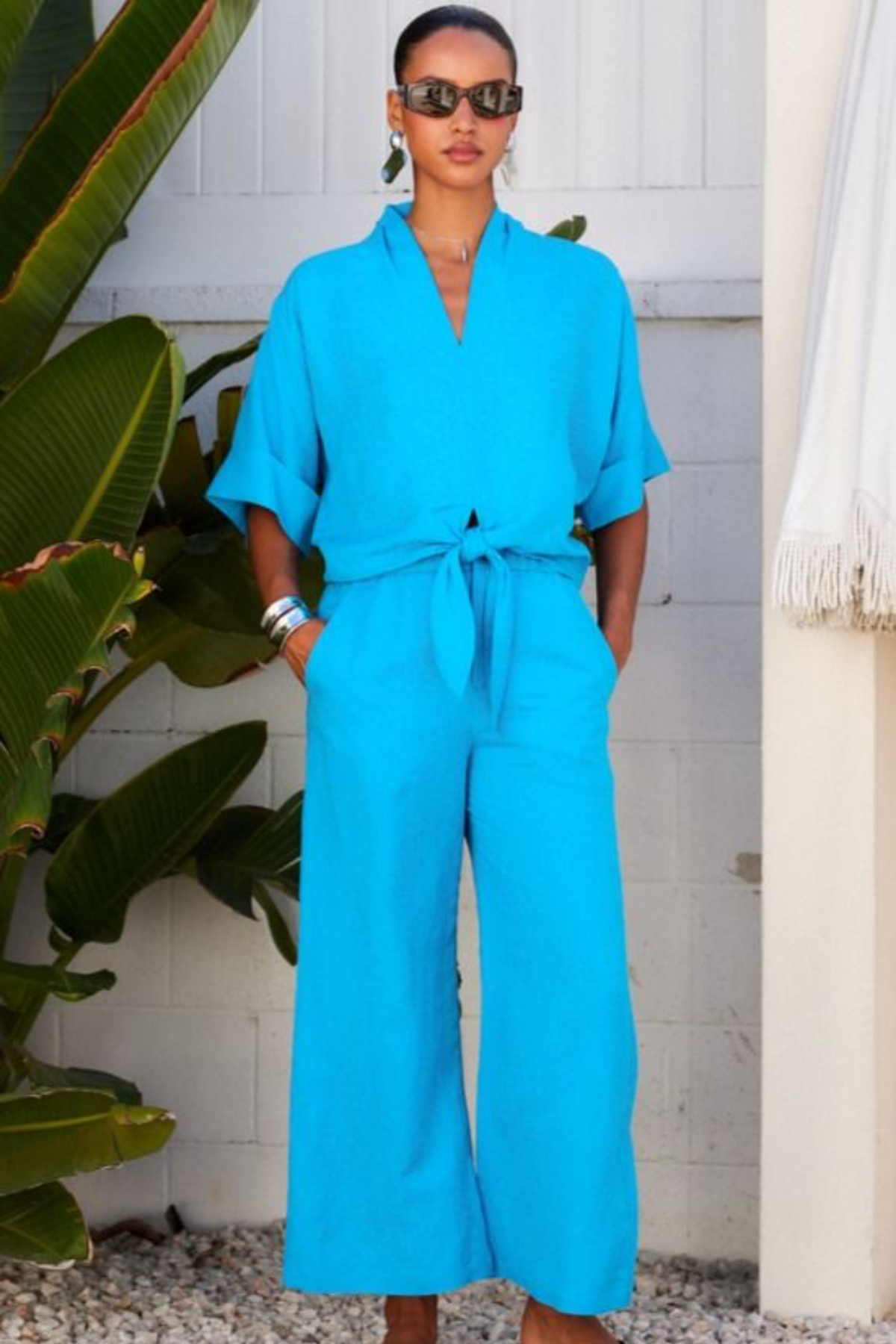 woman in blue set outside 