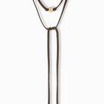 Brown bolo tie necklace with gold accents on a white background