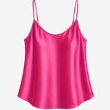 Women's fuchsia satin camisole featuring a V-neckline, adjustable straps, and a relaxed, silky silhouette.