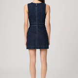 Woman wearing a blue denim dress on a white background