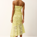Woman wearing a yellow lace set on a white background
