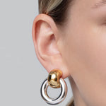 Statement gold knocker earrings with sculptural design