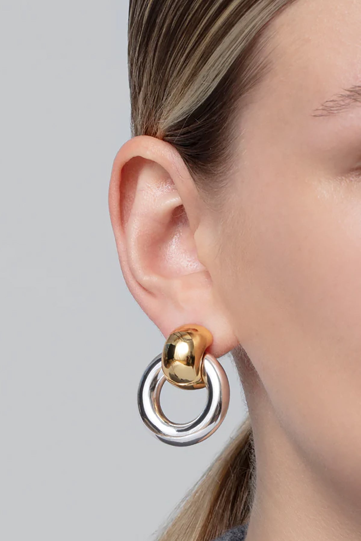 Statement gold knocker earrings with sculptural design