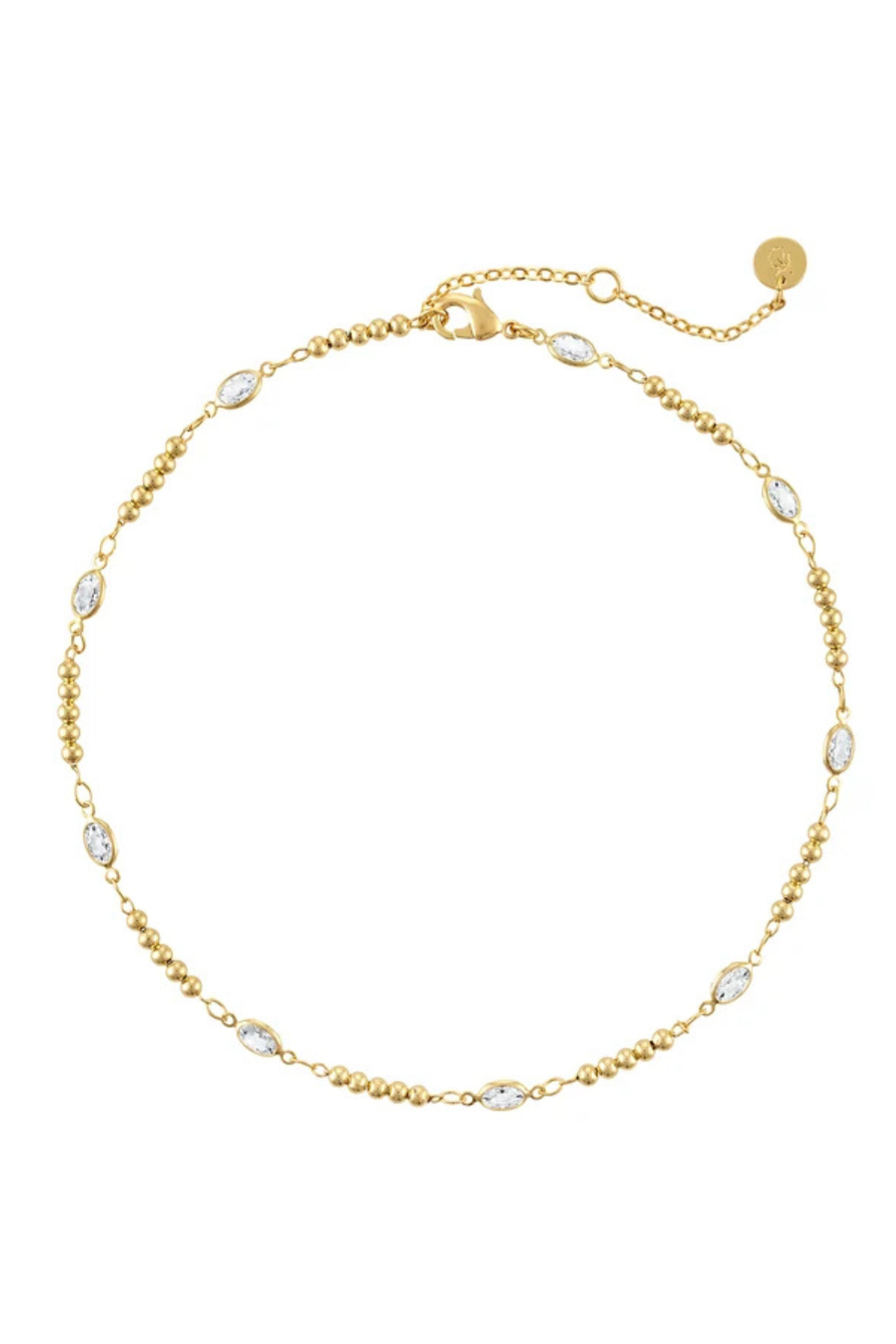 A delicate gold chain necklace with small oval clear stones spaced along the chain, displayed on a clean white background.
