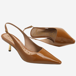 A pair of glossy brown patent leather slingback pumps with pointed toes and slim gold-tone heels, displayed on a light gray background.