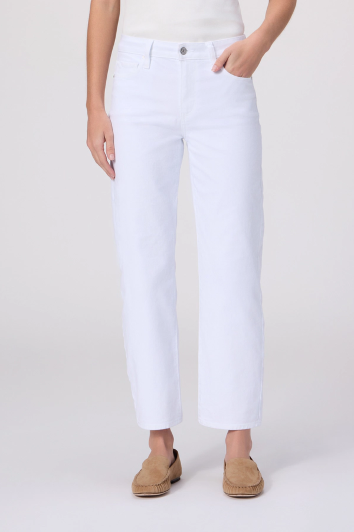Person wearing white pants on a plain background