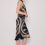 Model wearing a printed midi skirt with a coordinating floral-inspired pattern and flowing silhouette.