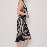 Model wearing a printed midi skirt with a coordinating floral-inspired pattern and flowing silhouette.