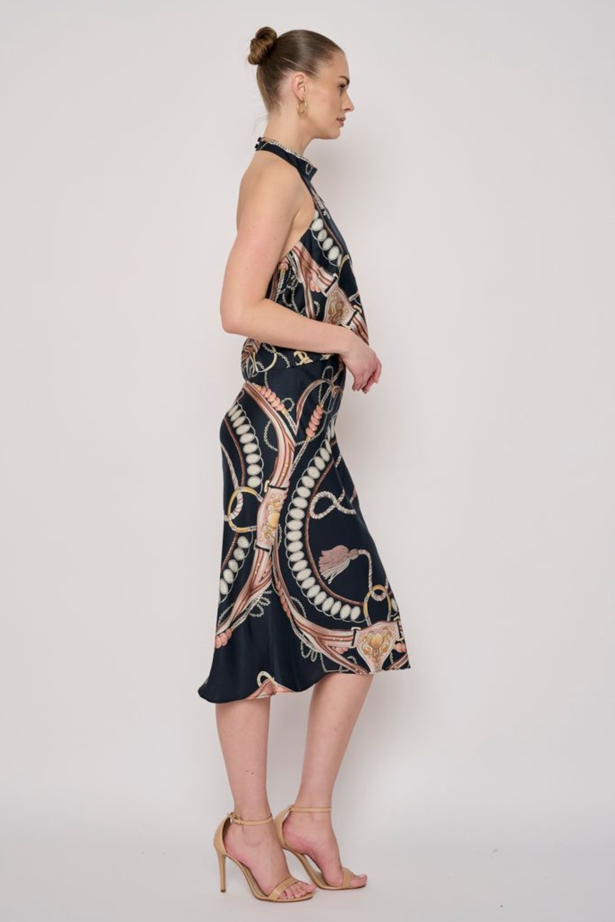 Model wearing a printed midi skirt with a coordinating floral-inspired pattern and flowing silhouette.
