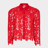 Red lace blouse with white floral patterns on a light gray background