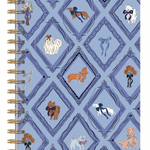 A spiral-bound notebook with a light blue cover featuring a repeating diamond pattern and illustrated dogs in various breeds and colors, bound with gold-tone metal coils on the left.