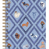 A spiral-bound notebook with a light blue cover featuring a repeating diamond pattern and illustrated dogs in various breeds and colors, bound with gold-tone metal coils on the left.