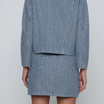 Cropped structured jacket in a blue tone.