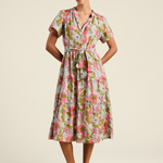 Woman wearing a floral dress on a beige background