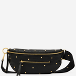 A black faux-leather belt bag with gold-tone hardware, featuring a pattern of small gold studs, a top zipper, a front zip pocket with a tassel, and a detachable shoulder strap, shown against a plain light gray background.
