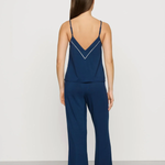 Navy blue Tencel™ modal pajama set featuring a V-neck camisole and matching full-length pants.
