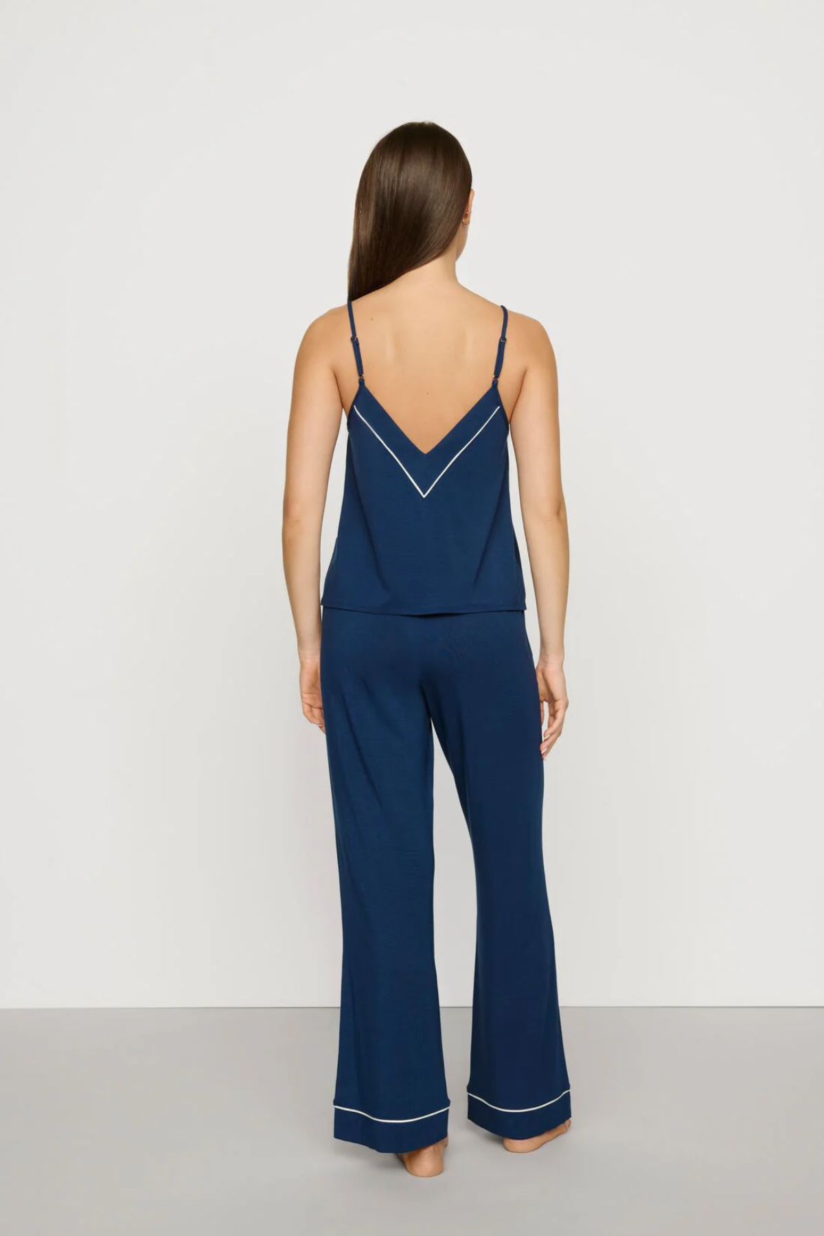 Navy blue Tencel™ modal pajama set featuring a V-neck camisole and matching full-length pants.