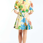 Woman wearing a colorful floral dress on a white background