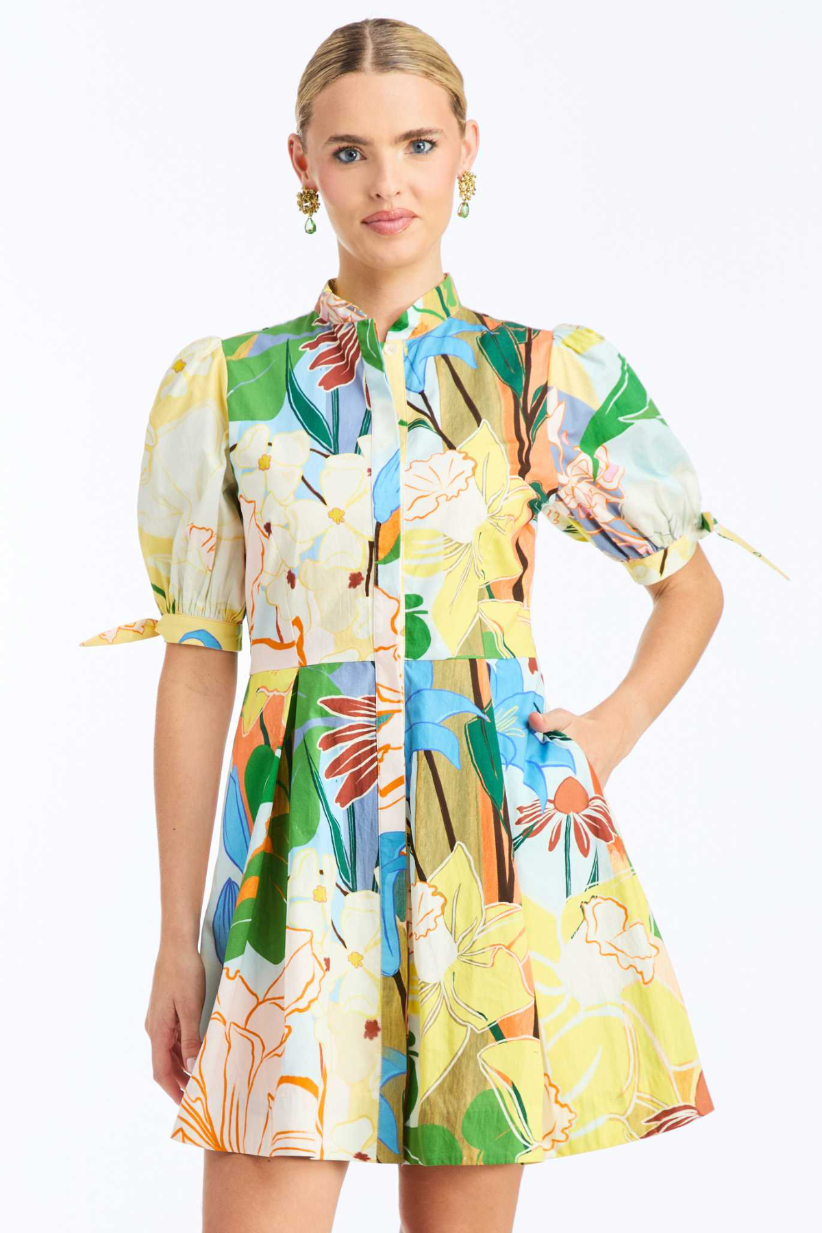 Woman wearing a colorful floral dress on a white background