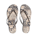 Pair of snake print flip-flops on a white background