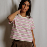 Woman wearing a striped shirt against a plain background
