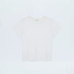 Minimal white top with a clean neckline and streamlined fit.