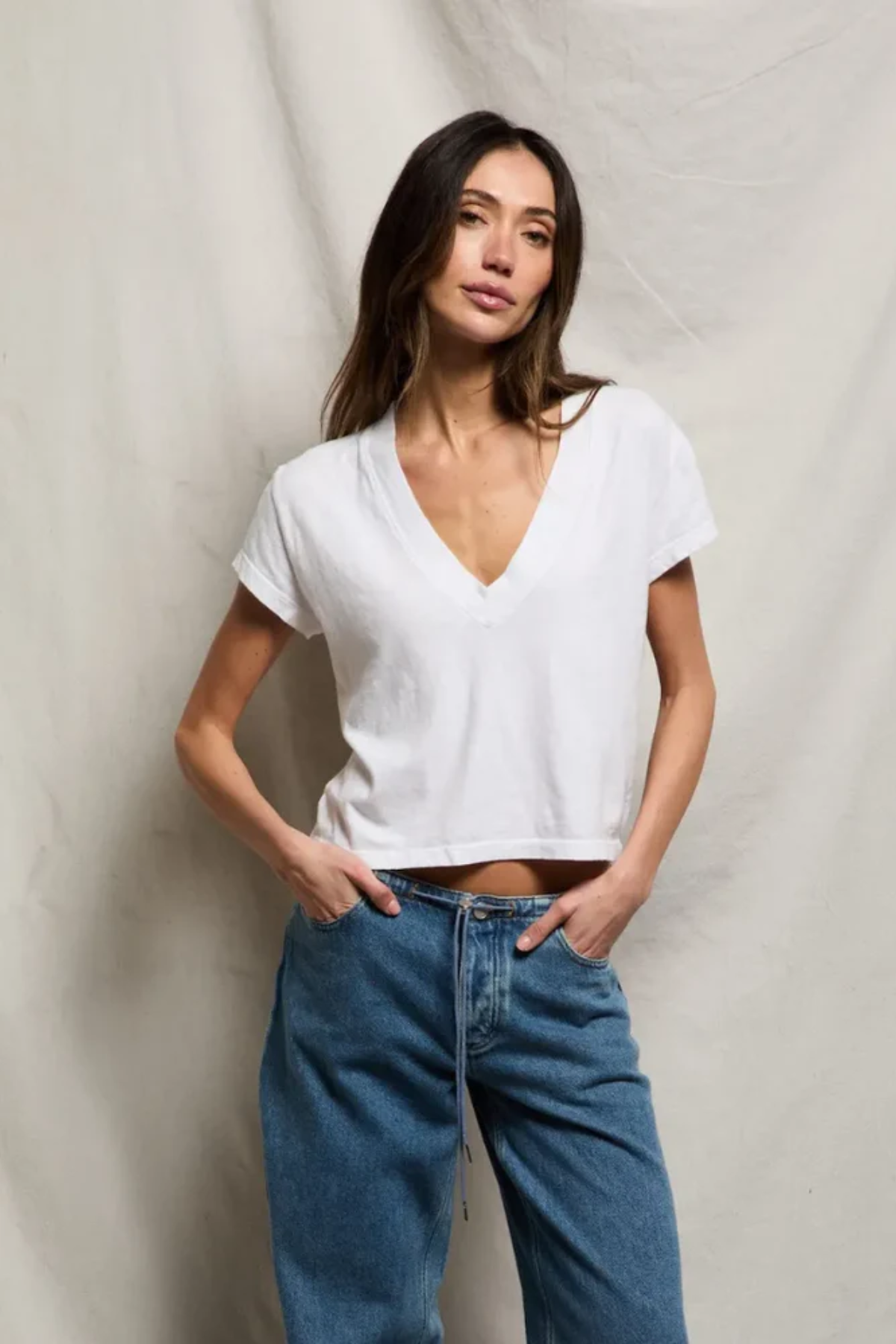 woman in white t-shirt  and denim 