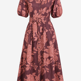 A midi-length floral print shirt dress with puff sleeves, a pointed collar, and a matching waist tie belt, shown against a plain light gray background.