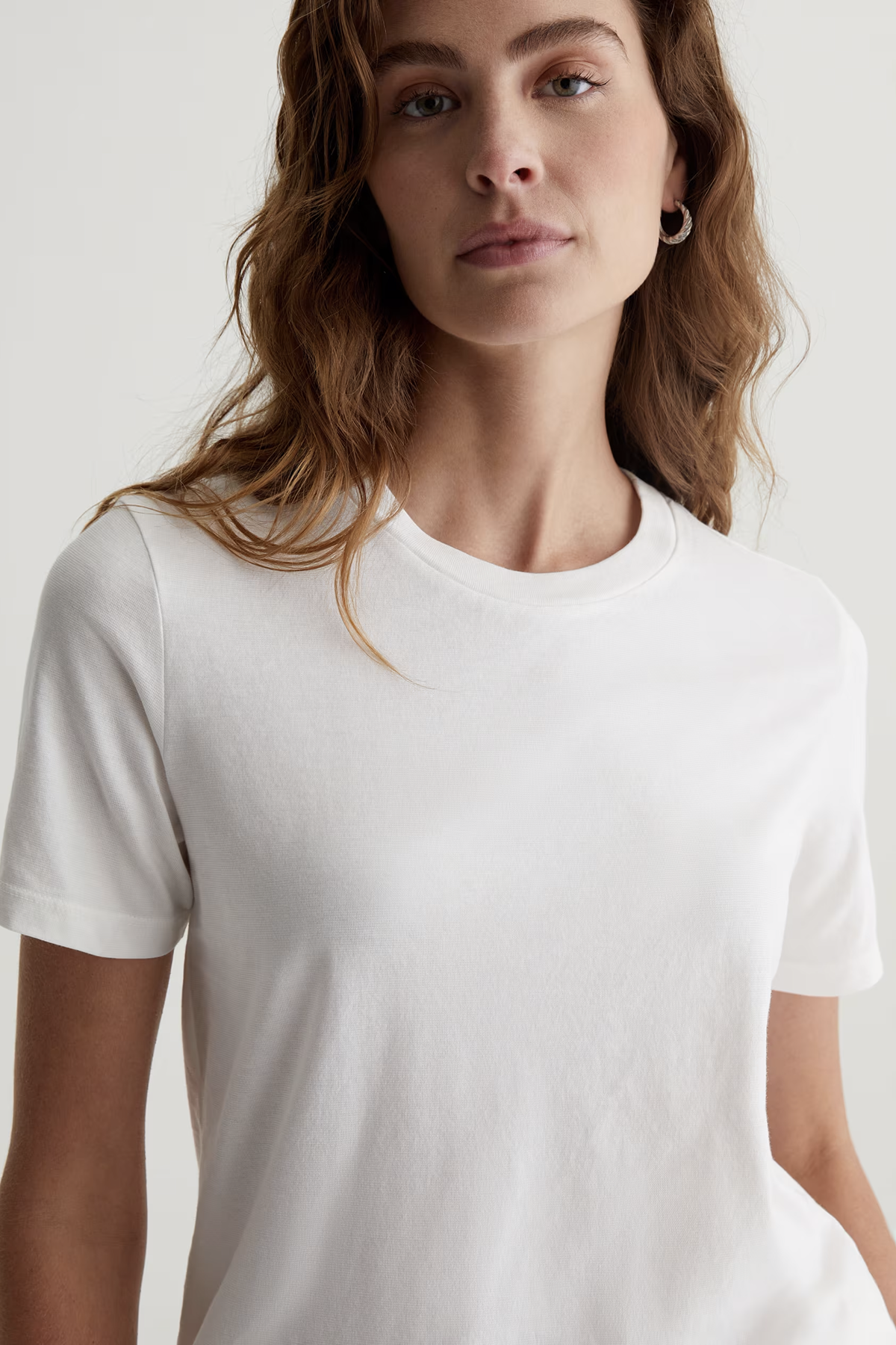 Classic white crewneck tee with a relaxed fit.