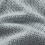 Lightweight pointelle knit sweater with a relaxed silhouette, styled with denim.