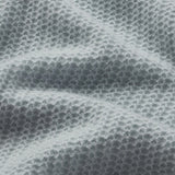 Lightweight pointelle knit sweater with a relaxed silhouette, styled with denim.