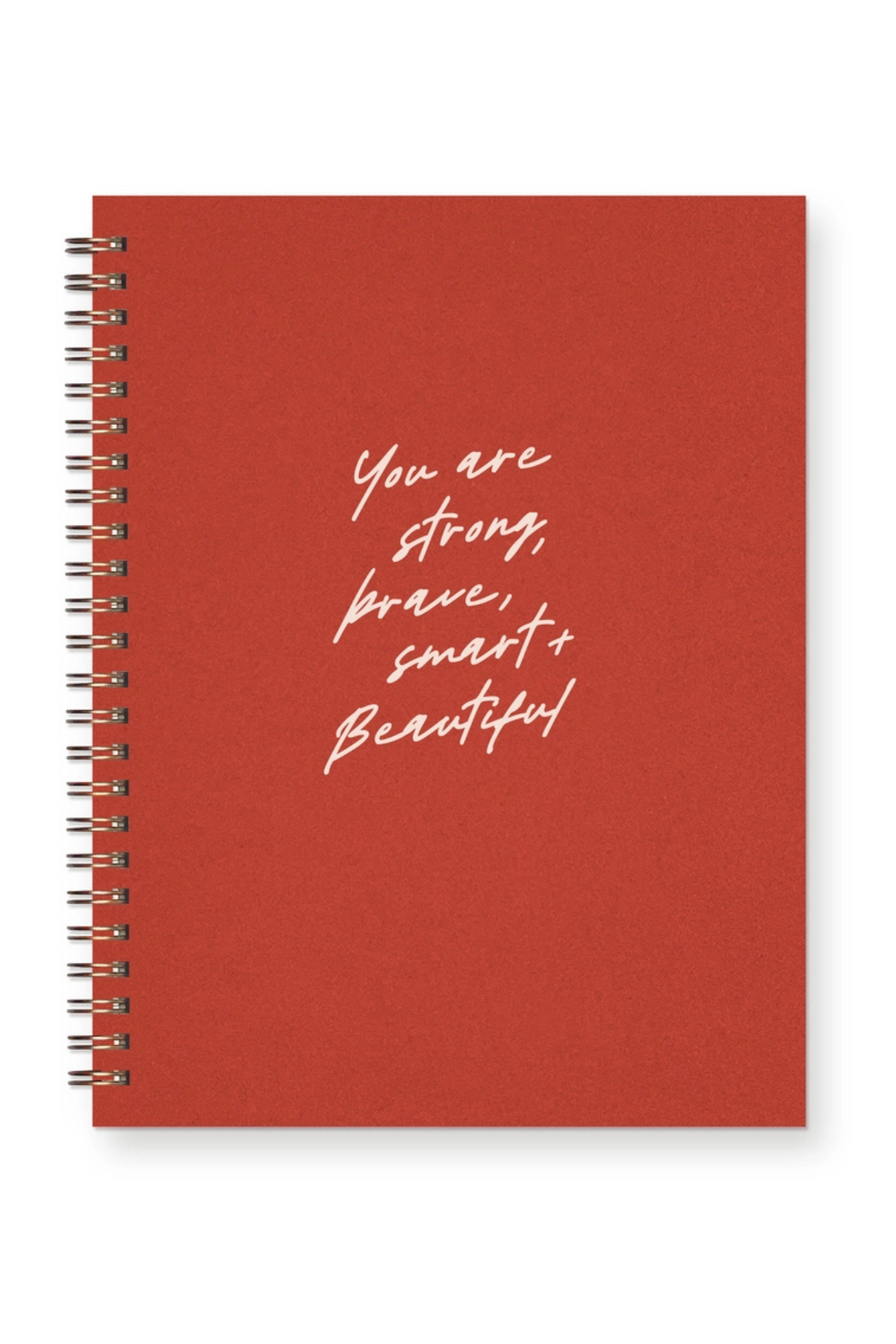 A red spiral-bound notebook with white handwritten-style text on the cover reading 'You are strong, brave, smart, and beautiful', shown on a clean white background.