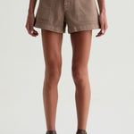 Person wearing brown shorts on a white background