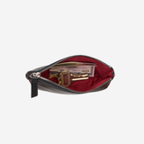 A dark brown leather zippered pouch shown open, revealing a deep red velvet-lined interior with various items inside, set against a plain light gray background.