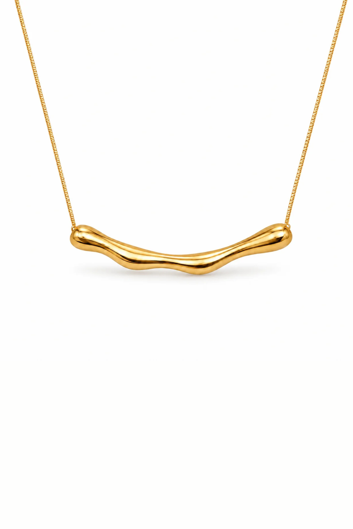 A gold wavy bar necklace on a delicate gold chain, presented against a clean white background.