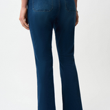 Person wearing blue jeans on a white background