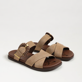 Pair of tan sandals with brown straps on a white background