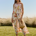 woman in field in matching printed set 