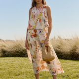 woman in field in matching printed set 