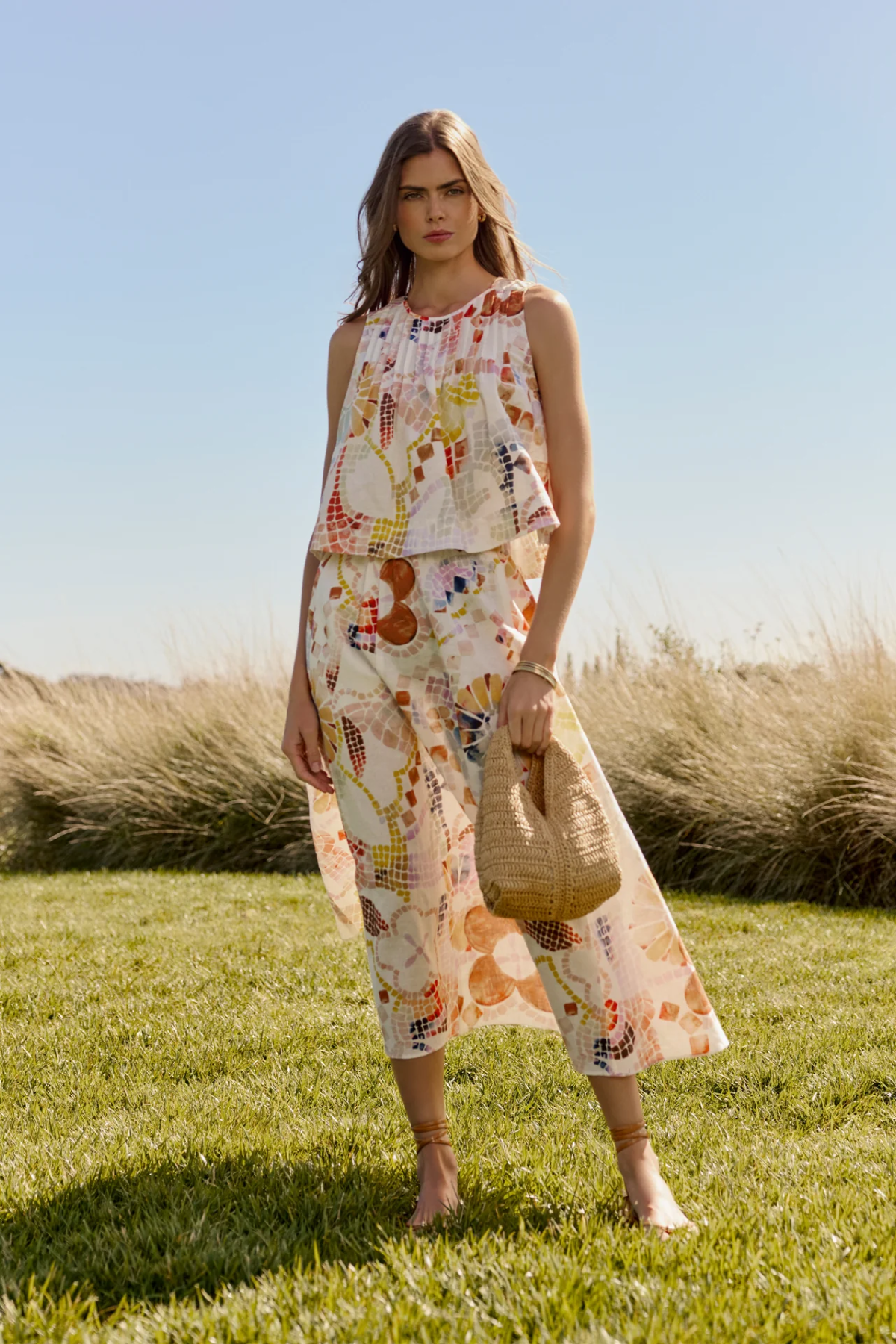 woman in field in matching printed set 